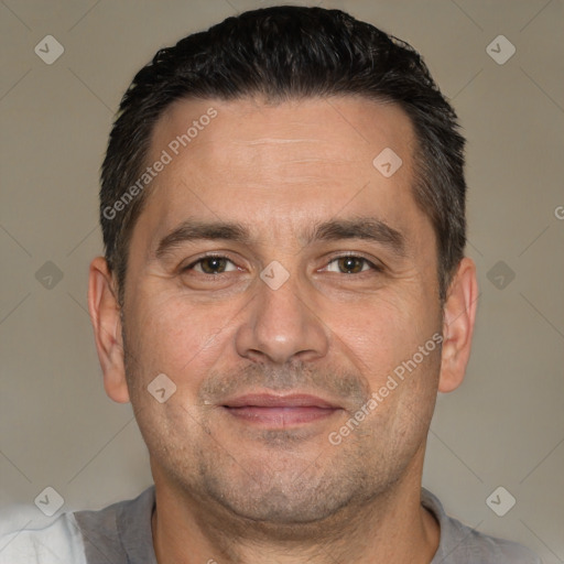 Joyful white adult male with short  brown hair and brown eyes