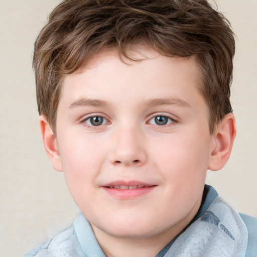 Joyful white child male with short  brown hair and blue eyes