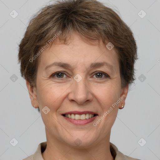 Joyful white adult female with short  brown hair and brown eyes