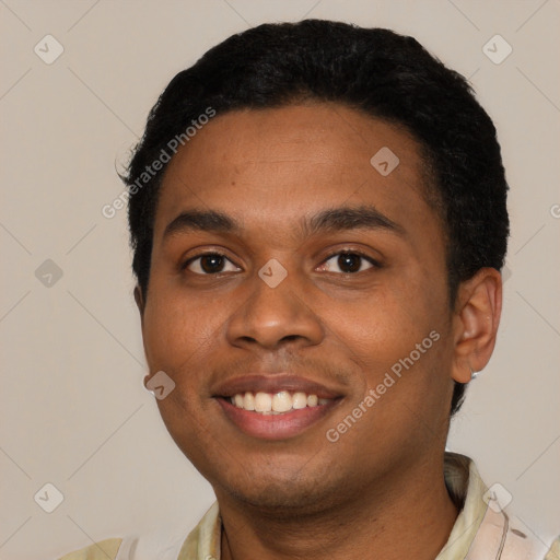 Joyful black young-adult male with short  black hair and brown eyes