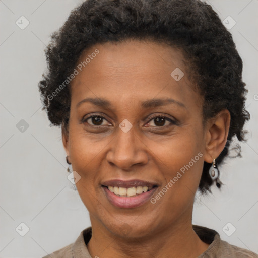 Joyful black adult female with short  brown hair and brown eyes