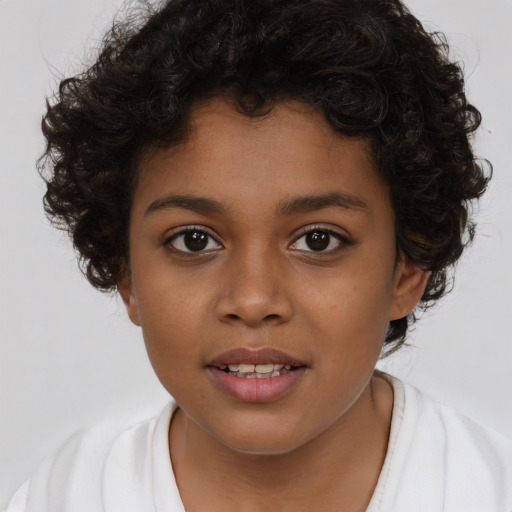 Joyful latino child female with medium  brown hair and brown eyes