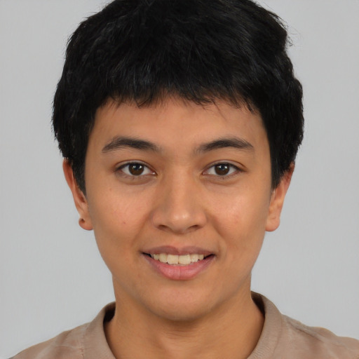 Joyful asian young-adult male with short  black hair and brown eyes