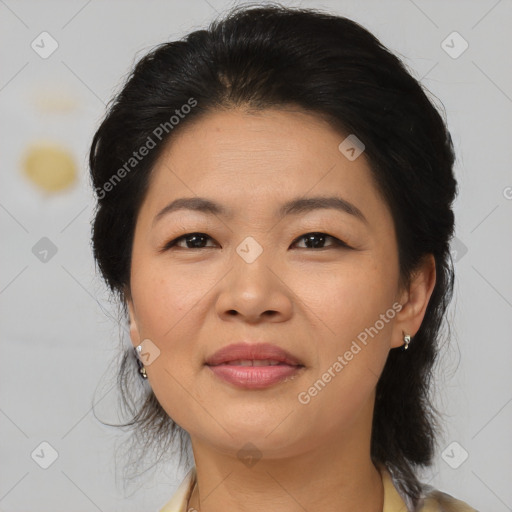 Joyful asian adult female with medium  brown hair and brown eyes