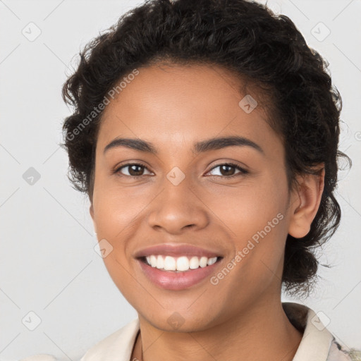 Joyful latino young-adult female with short  brown hair and brown eyes