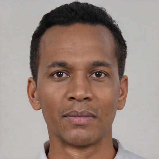 Neutral black young-adult male with short  black hair and brown eyes