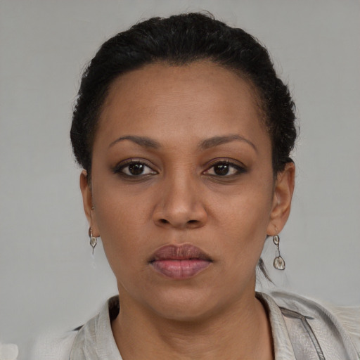 Neutral black young-adult female with short  black hair and brown eyes