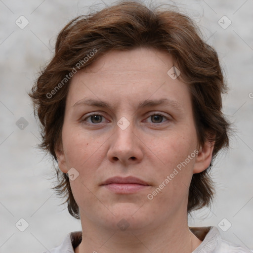 Joyful white adult female with medium  brown hair and grey eyes