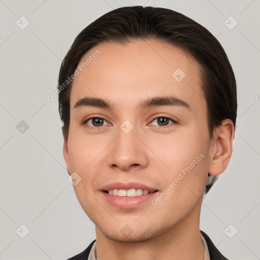 Joyful white young-adult male with short  brown hair and brown eyes