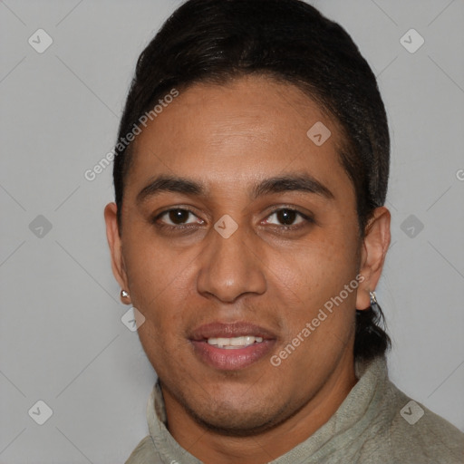 Joyful latino young-adult male with short  black hair and brown eyes