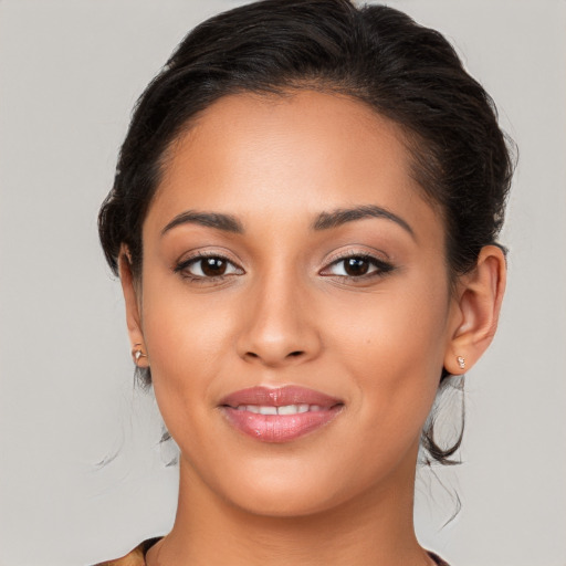 Joyful white young-adult female with long  brown hair and brown eyes