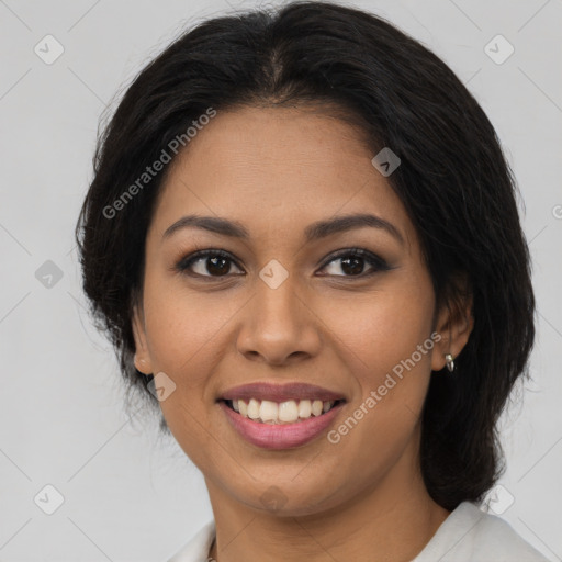 Joyful latino young-adult female with medium  brown hair and brown eyes