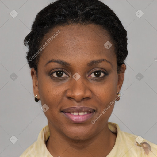 Joyful black young-adult female with short  black hair and brown eyes