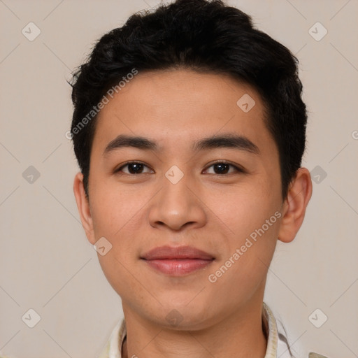 Joyful asian young-adult male with short  brown hair and brown eyes