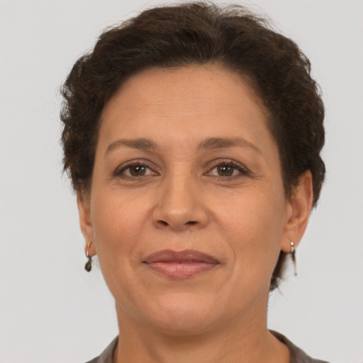 Joyful white adult female with short  brown hair and brown eyes