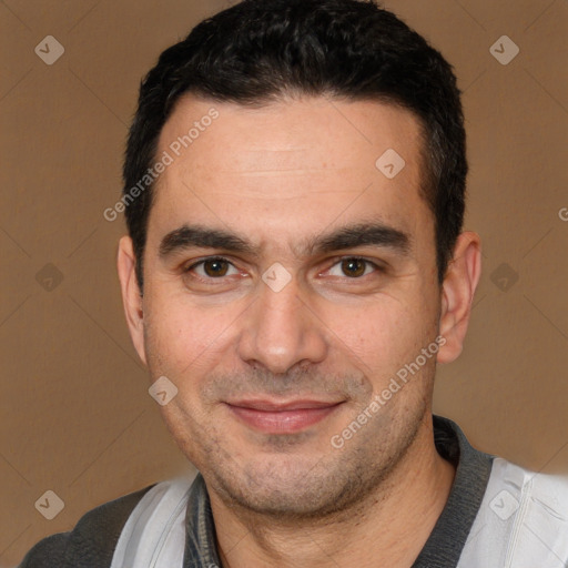 Joyful white adult male with short  black hair and brown eyes