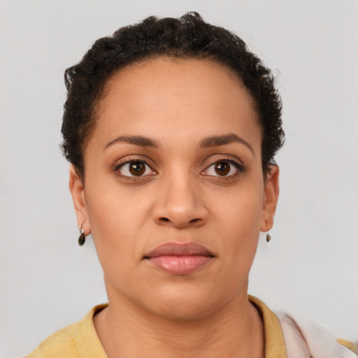 Joyful latino young-adult female with short  brown hair and brown eyes