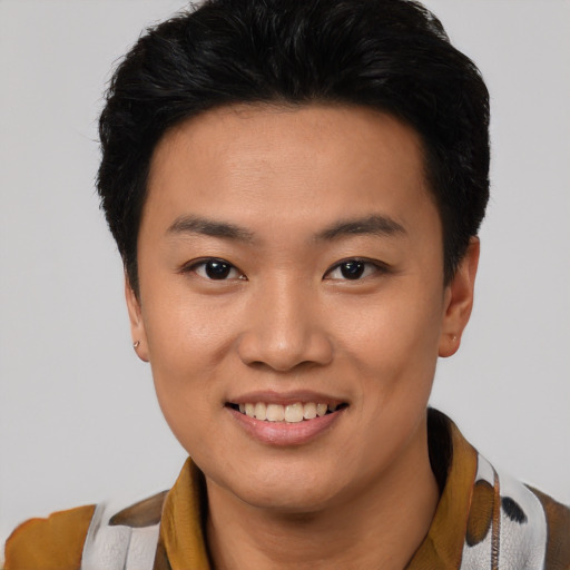 Joyful asian young-adult male with short  black hair and brown eyes