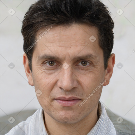 Joyful white adult male with short  brown hair and brown eyes