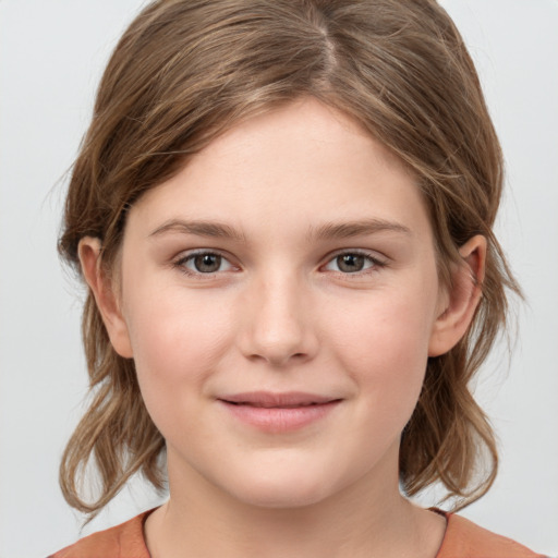 Joyful white child female with medium  brown hair and grey eyes