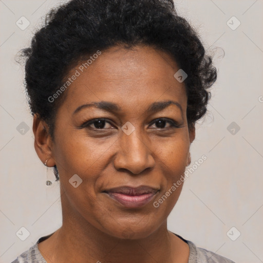 Joyful black adult female with short  brown hair and brown eyes