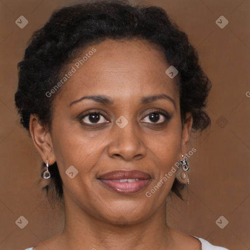 Joyful black adult female with medium  brown hair and brown eyes