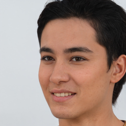 Joyful asian young-adult male with short  brown hair and brown eyes