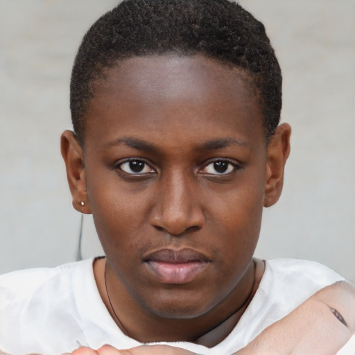 Neutral black young-adult female with short  brown hair and brown eyes