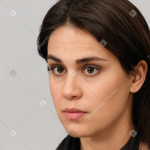 Neutral white young-adult female with long  brown hair and brown eyes