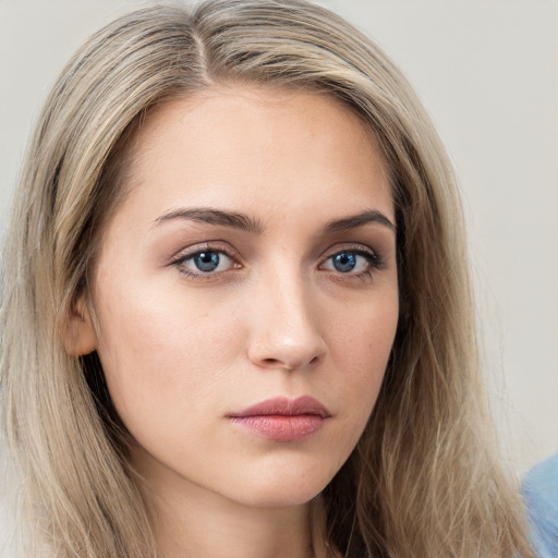 Neutral white young-adult female with long  brown hair and grey eyes