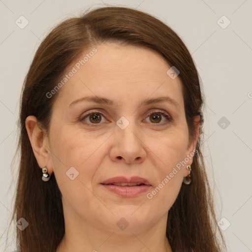 Joyful white adult female with long  brown hair and grey eyes