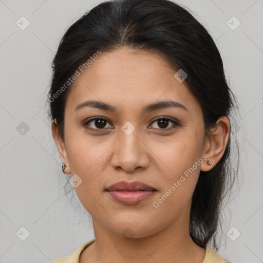 Joyful latino young-adult female with medium  brown hair and brown eyes