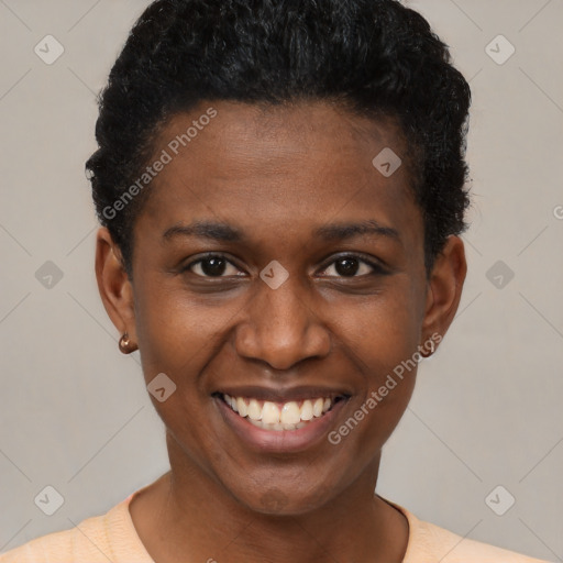 Joyful black young-adult female with short  black hair and brown eyes