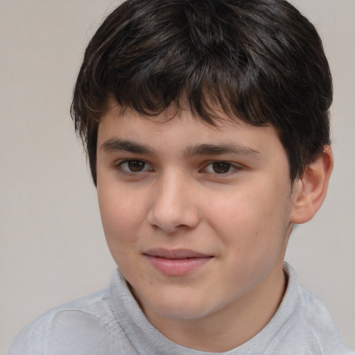 Joyful white child male with short  brown hair and brown eyes