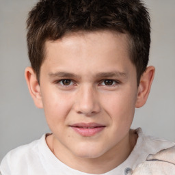 Joyful white child male with short  brown hair and brown eyes