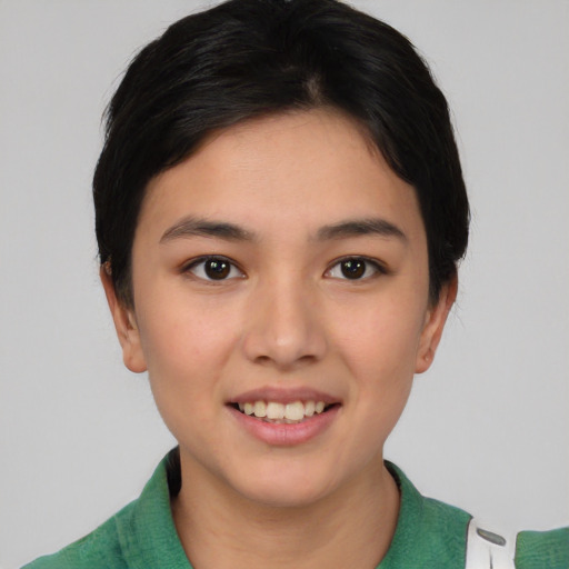 Joyful asian young-adult female with short  black hair and brown eyes