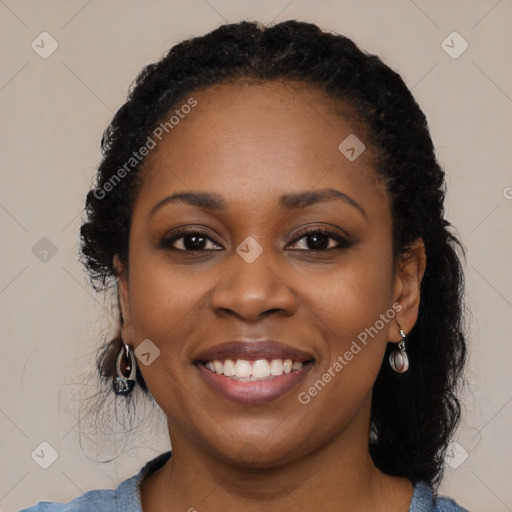 Joyful black young-adult female with medium  black hair and brown eyes