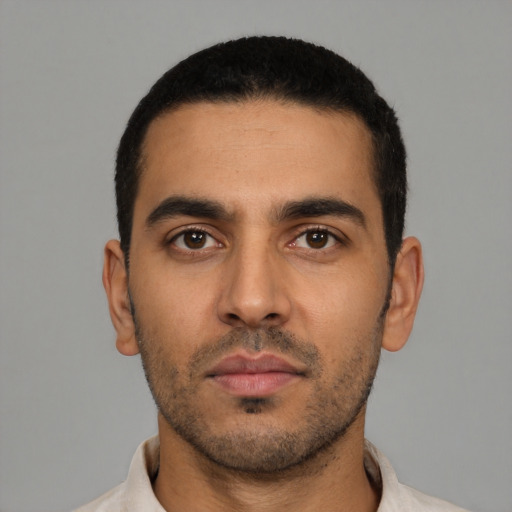 Neutral latino young-adult male with short  black hair and brown eyes