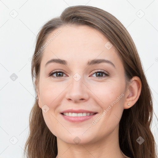 Joyful white young-adult female with long  brown hair and grey eyes