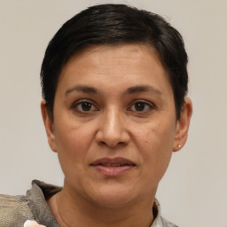 Joyful white adult female with short  brown hair and brown eyes