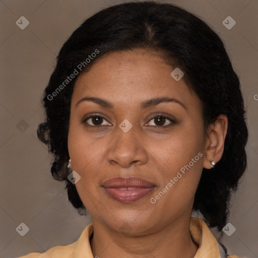 Joyful latino adult female with medium  brown hair and brown eyes