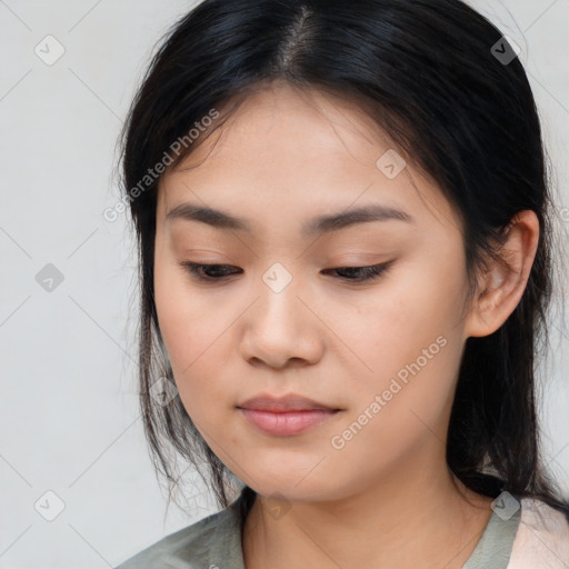 Joyful asian young-adult female with medium  brown hair and brown eyes