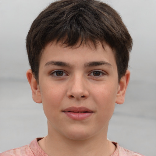 Joyful white child male with short  brown hair and brown eyes