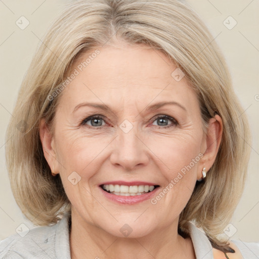 Joyful white adult female with medium  brown hair and blue eyes