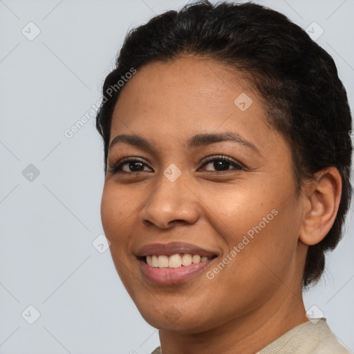 Joyful latino young-adult female with short  brown hair and brown eyes