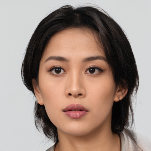 Neutral asian young-adult female with medium  black hair and brown eyes