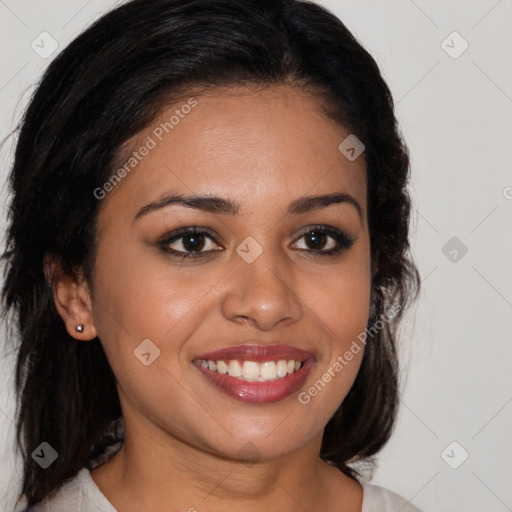 Joyful latino young-adult female with long  brown hair and brown eyes