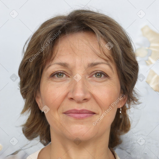 Joyful white adult female with medium  brown hair and grey eyes