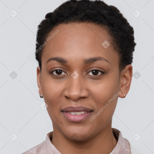 Joyful black young-adult female with short  black hair and brown eyes