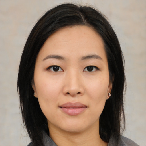 Neutral asian young-adult female with medium  black hair and brown eyes